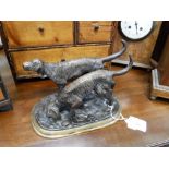 A PATINATED BRONZE STUDY OF HUNTING DOGS, 9" wide