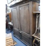 A GEORGE III STYLE OAK CUPBOARD with fielded panelled doors, 73.5" high x 61" wide