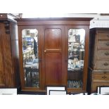 AN EDWARDIAN MAHOGANY WARDROBE, with central marquetry panel and flank mirrored doors, 81" high x