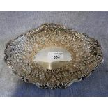 A VICTORIAN SILVER BON BON DISH with repousse floral decoration within a scrolled border, London