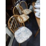 ERCOL; A SET OF SIX BEECH STICK BACK CHAIRS with pale elm seats