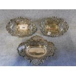 A PAIR OF VICTORIAN SILVER BON BON DISHES with repousse and pierced floral decoration, Chester