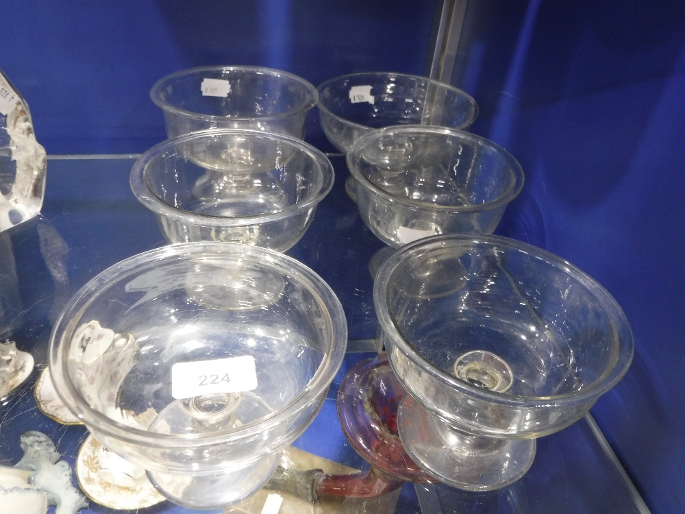 A SET OF SIX 19TH CENTURY SUNDAE GLASSES with flared rims and knop stems