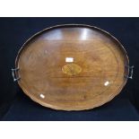 A 19TH CENTURY MAHOGANY OVAL TEA TRAY, with feather banding and inlaid central panel, 25" wide