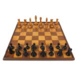 Boxwood chess set together with a mahogany chess board, the largest chess piece 8cm high : For