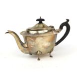 Walker & Hall silver teapot raised on four feet with ebonised wood handle and knop, Sheffield