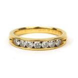 18ct gold diamond half eternity ring set with seven diamonds, size N, approximate weight 4.3g :