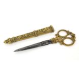 19th Century French brass and steel seamstress scissors, housed in an ornate floral case, 25cm