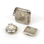 Large rectangular silver vesta with engraved decoration, silver sovereign case and a silver pill