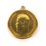 Nicholas II 1903 ten rouble gold coin, housed in a gold coloured metal pendant mount,