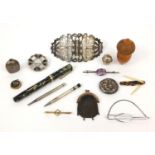 Group of objects including a silver nurses belt buckle, Swan marbleised fountain pen with 14ct