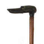 Wooden walking stick with carved horn handle in the form of a dogs head, with beaded glass eyes,