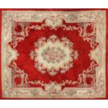 Large rectangular floral carpet onto a red ground, 340cm x 243cm : For Further Condition Reports