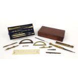 19th century mahogany cased drawing instrument set containing brass protractors and an ivory