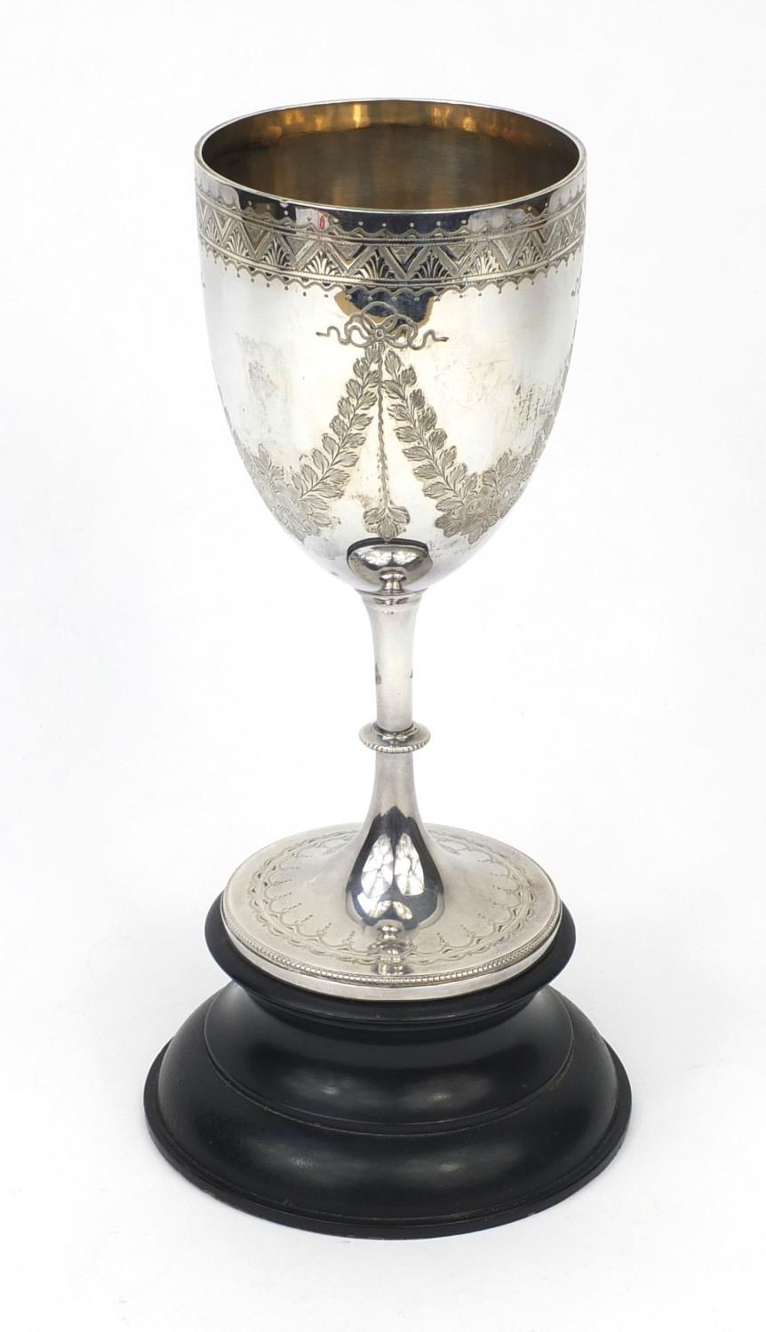 Large silver goblet with engraved floral swag decoration, R.P London 1906, raised on an ebonised - Image 2 of 4