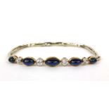 Unmarked white metal cabochon sapphire and diamond expandable bracelet, set with five graduated