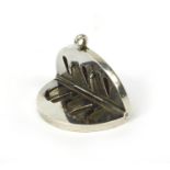 19th century silver coloured metal folding blood letting pendant, with engraved initials, 4.5cm in