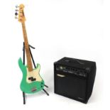 Yamaha electric guitar with green body, together with a Ashdown amplifier, the guitar impressed