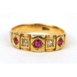 18ct gold ruby and diamond ring set with three ruby's and two diamonds, size M, approximate weight