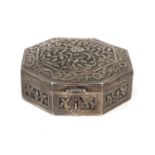 Oman octagonal silver box with hinged lid ,profusely embossed with flowers and foliage, 9.5cm in