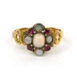 18ct gold opal and ruby ring set with five opals and four rubies, the shank decorated with