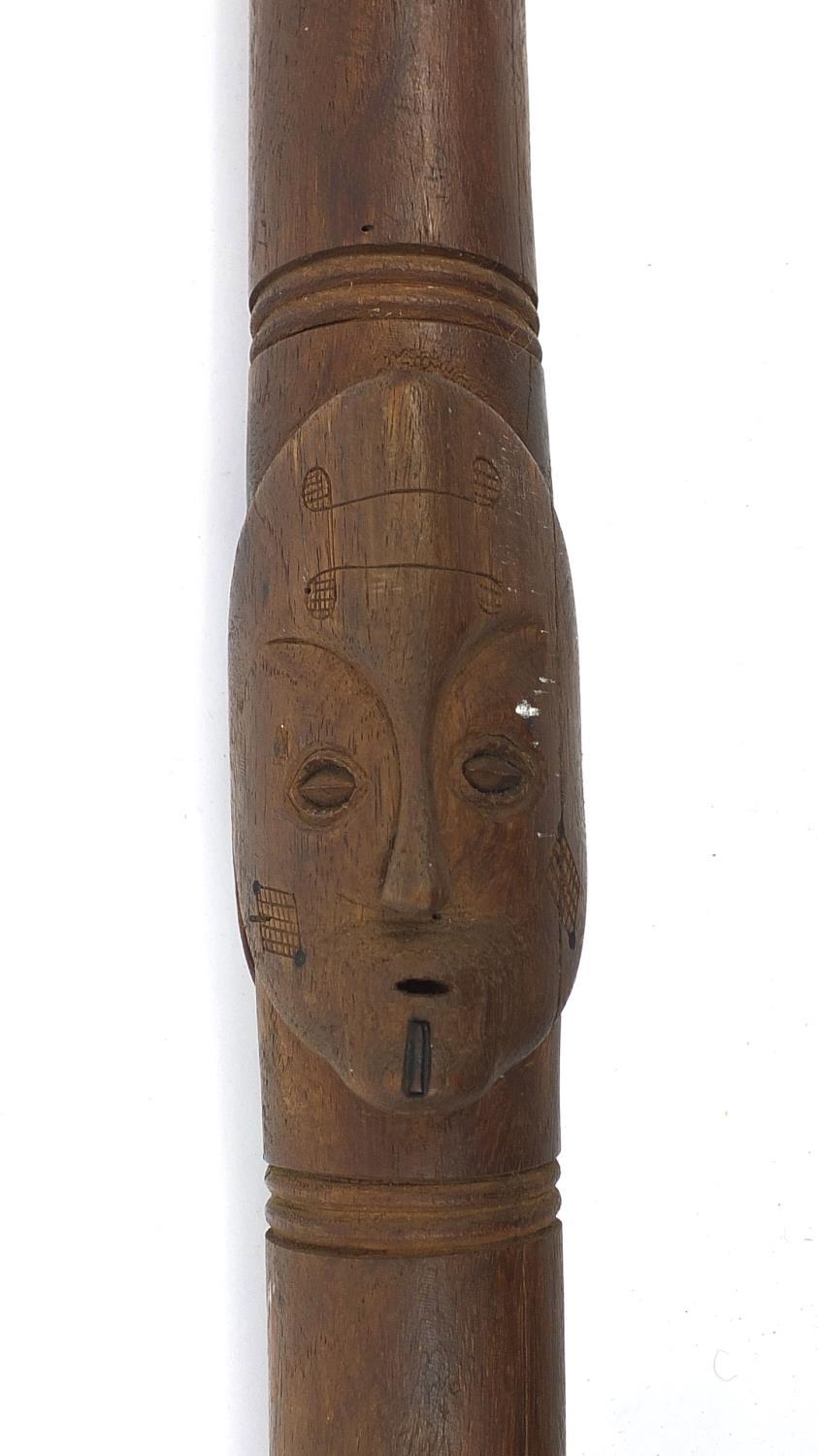 African hardwood ceremonial spear carved in relief with face masks, 208cm long : For Further - Image 3 of 5