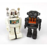 Two vintage Japanese plastic robots, the largest 25cm high : For Further Condition Reports Please