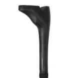 Ebonised walking stick with carved handle in the form of a shoe, 87cm long : For Further Condition