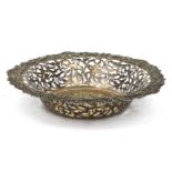 Circular silver bread basket with pierced decoration, the boarder moulded with shells and flowers,