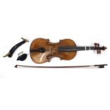 Old wooden violin with one piece back and scrolled neck, together with a bow and fitted carrying