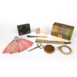 Group of sewing related objects including an ivory vesta case, set of book shaped containers,