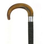 Anglo Indian hardwood walking stick with silver coloured collar and horn handle, profusely carved