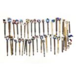 Collection of sewing interest wooden and bone bobbins, mostly with glass beads, the largest