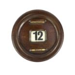 Vintage circular oak wall day date calendar, 23cm in diameter :Request a condition report on this