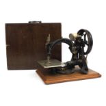 Willcox & Gibbs sewing machine, raised on a plinth base, serial No.A473100, 32cm in length :