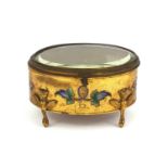 Oval gilt brass and enamelled casket with bevelled glass and griffin legs, 10cm high x 16cm wide x