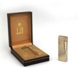 Boxed Dunhill silver plated lighter with engine turned decoration, factory marks to the base, 7cm