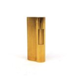 Dunhill gold plated lighter with engine turned decoration, factory marks to the base, 6.5cm high :