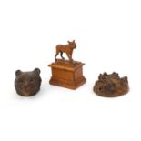 Group of treen including black forest bears head stamp box and a carved yew wood study of a mastiff,