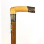 Malacca walking cane with silver mounted ivory handle, the silver mount with engraved floral