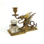 Victorian brass candlestick desk stand, in the form of a dragon with glass inkwell, 18.5cm high :