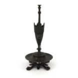 Victorian bronze oil lamp with masks and lion paw feet, 25cm high