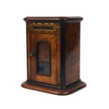 Burr walnut and ebonised letterbox, with brass flap above a glazed door, 31cm high x 23cm wide x