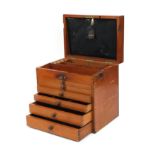 The Dental Manufacturing Co of London mahogany dental case, with lift up top above six pull out