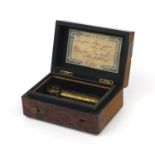 Miniature yew music box, the hinged lid opening to reveal a brass cylinder playing on two airs,
