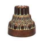 Victorian copper jelly mould, stamped Bennington Jermyn St to the rim, 13cm high