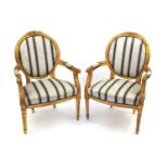 Pair of Louis XVI style gilt wood fauteuils with striped upholstery, 101cm high