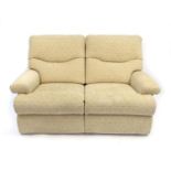 Beige upholstered two seater settee, 165cm long