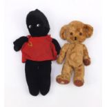Vintage Merrythought pumpkin head bear with rattle in one ear and a Merrythough black doll with