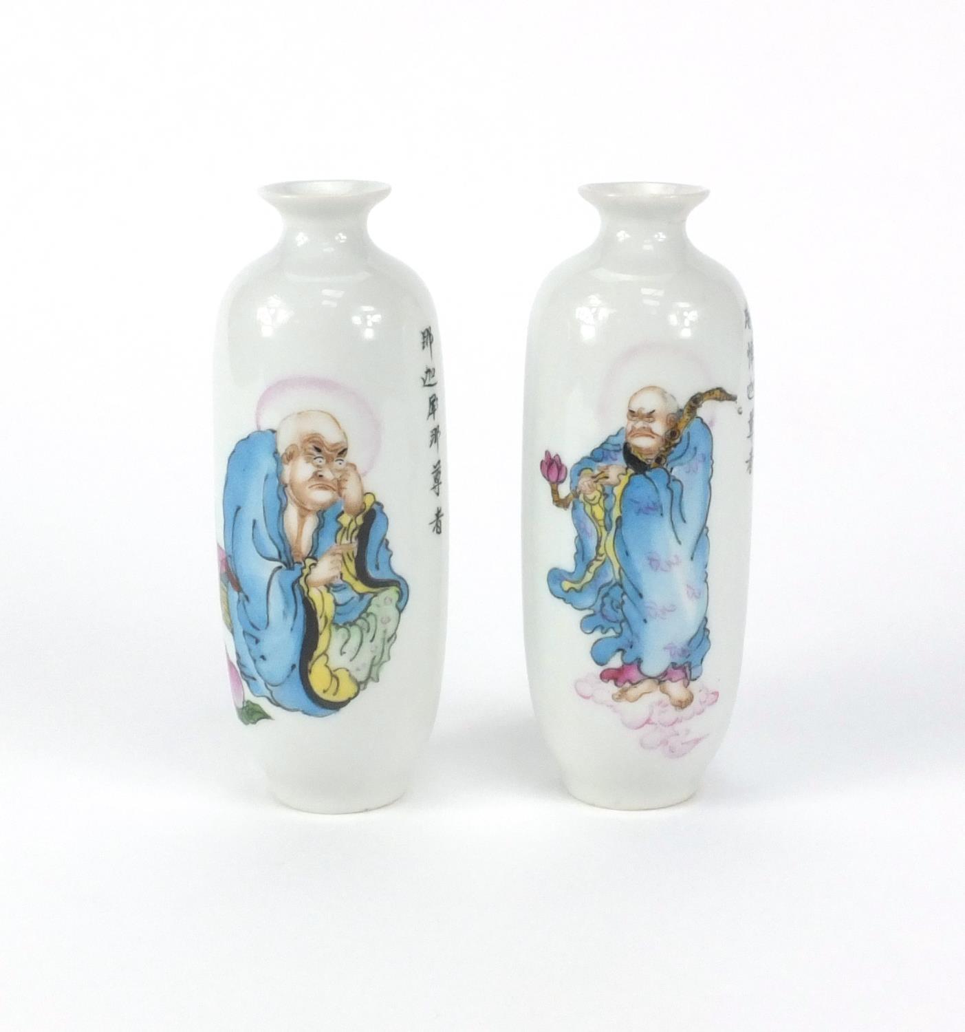 Pair of Chinese porcelain vases hand painted with figures, peaches and script, both with six